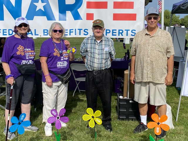 group posing in front of NARFE banner