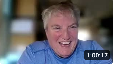 smiling woman with blue shirt