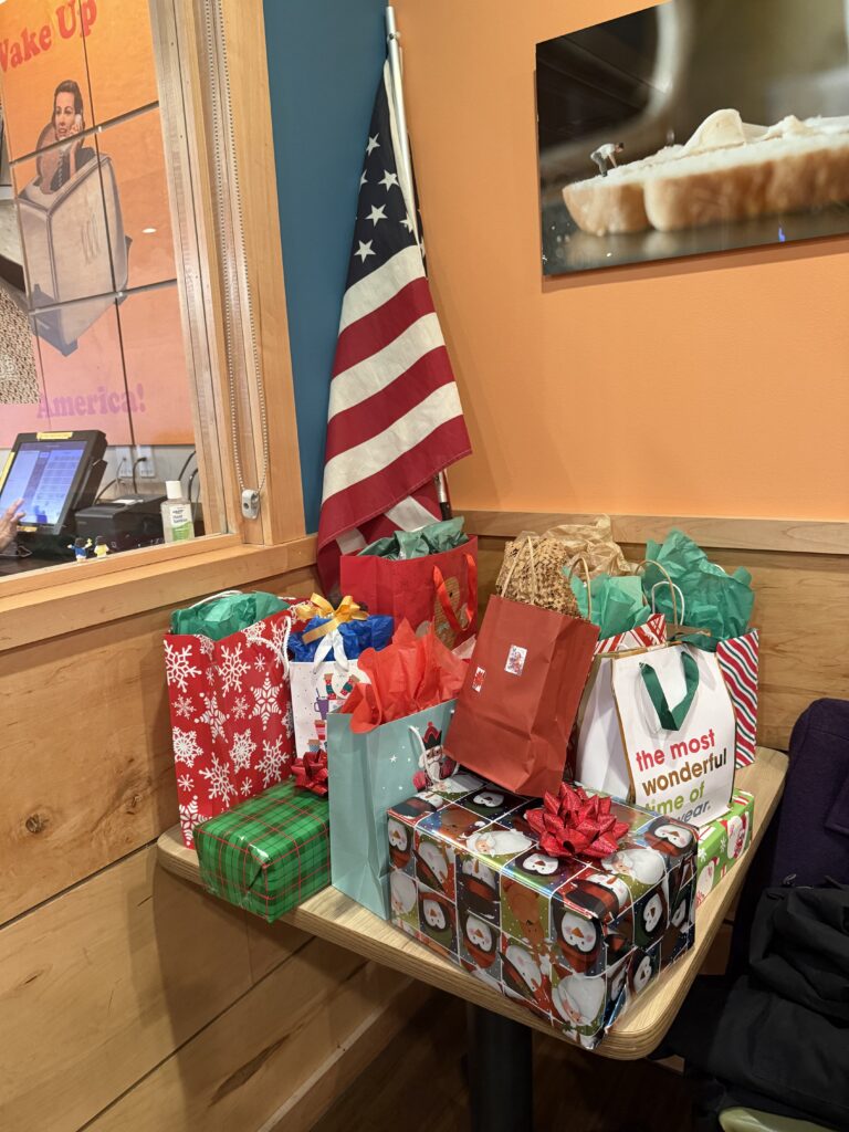 Table with wrapped Christmas gifts on top