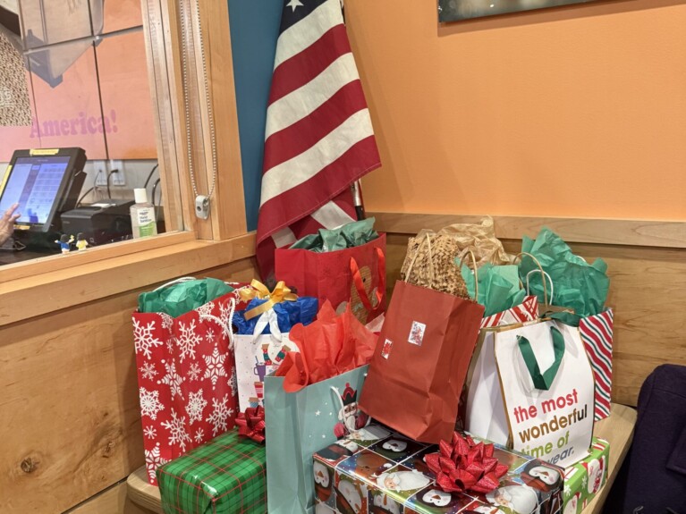 Table with wrapped Christmas gifts on top
