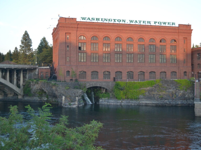 Red brick building along side river.