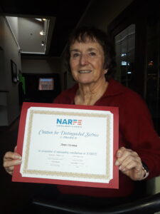 Portrait of lady holding Citation of Distinguished Service