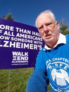 Self portrait of man in front of Alzheimer's sign.
