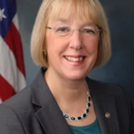 Portrait photo of blond lady.