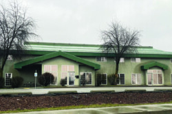 Street view of green office building.