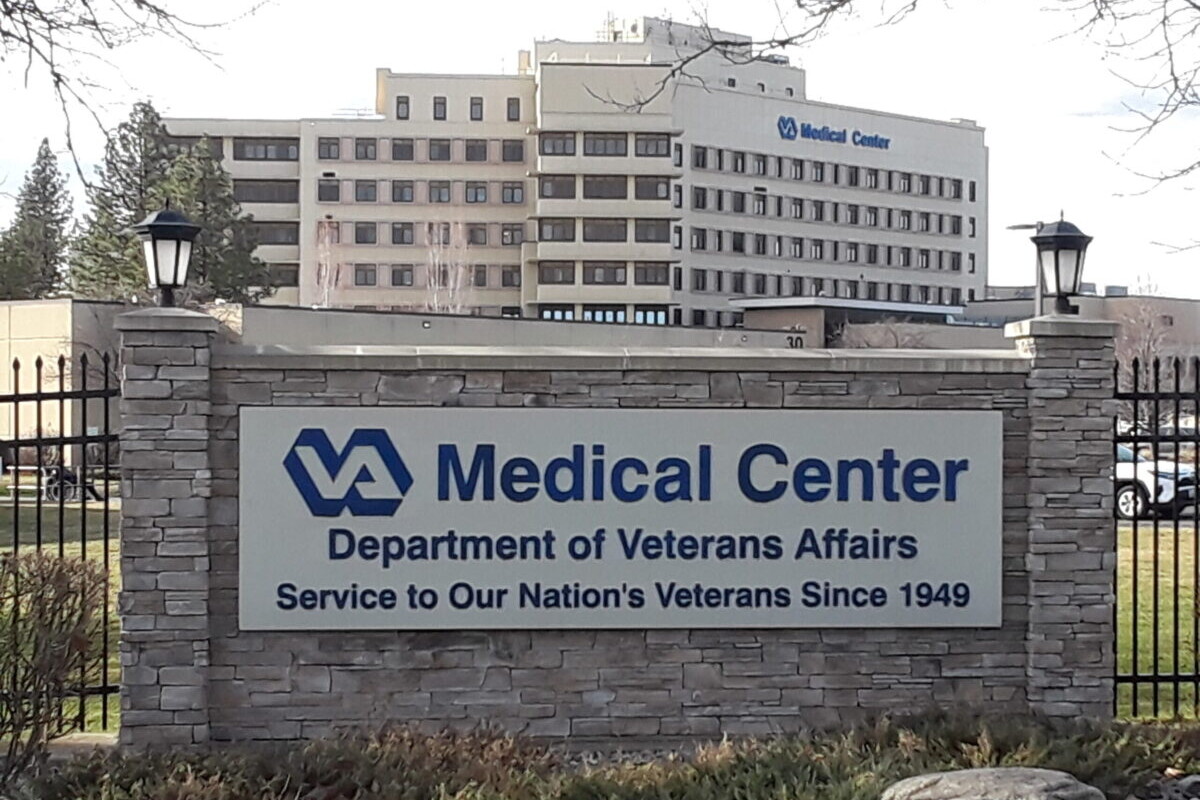 Sign publicizes VA Medical Center in front of multi-storied building