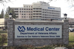 Sign publicizes VA Medical Center in front of multi-storied building