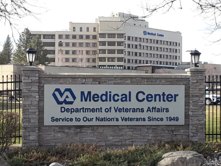 Sign publicizes VA Medical Center in front of multi-storied building