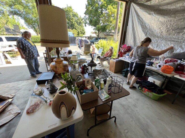 Garage sale items looking from inside to outside.