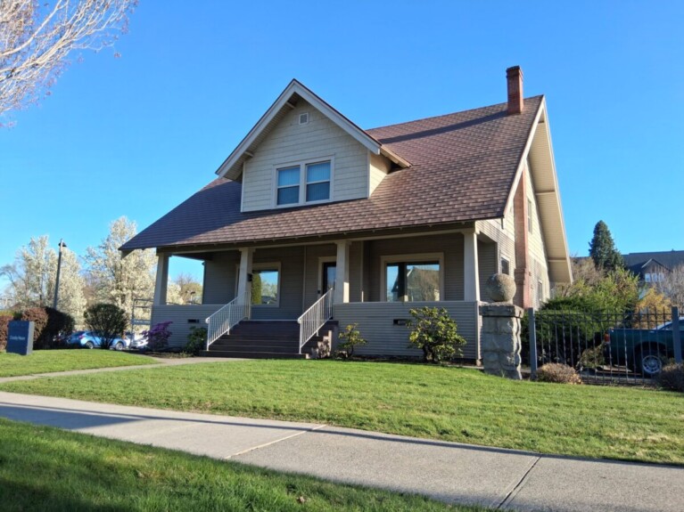 Street view of small house with covered porch