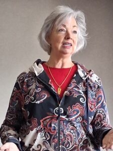 Portrait photo of lady speaking.