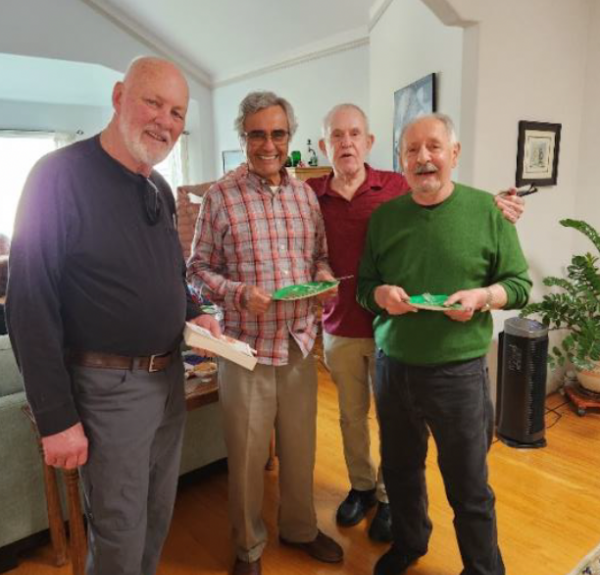 four men at a party