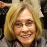 smiling woman with glasses