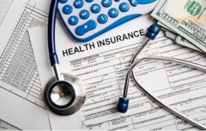 stethoscope, calculator and paper money