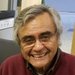 smiling man with glasses