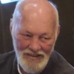 bald man with white beard