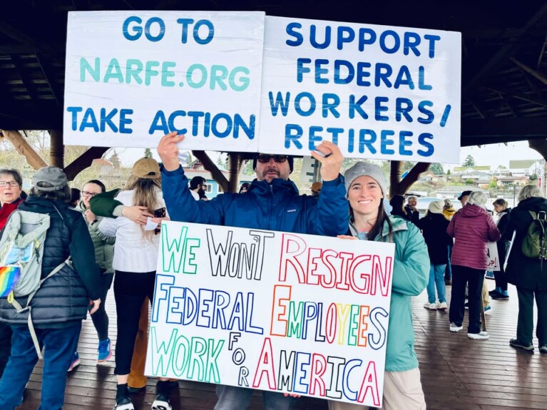 People holding signs