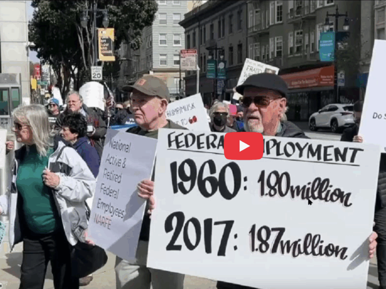 group of people on street corner with signs