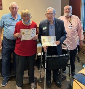 Picture of KY Federation President and Chapter 0097 President presenting Distinguished Members award to two members.