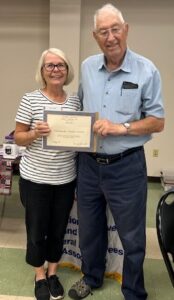 Picture of Chapter President Kenneth Overhults presenting Distinguished Members award to Kathy Yates, Chapter Membership/Retention chair.