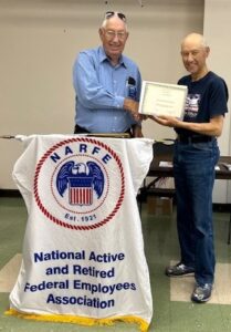 Picture of Chapter President Kenneth Overhults presenting Ron Ray, Chapter NARFE-PAC chair, the Distinguished member award at our October 1, 2025, Chapter Business meeting.