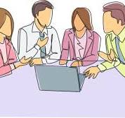 image of group of people centered around a laptop