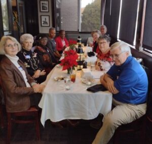 Picture of People sitting around the table. 2024 Holiday Luncheon at Amerigo Italian Restaurant