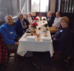 Picture of People sitting around the table. 2024 Holiday Luncheon at Amerigo Italian Restaurant