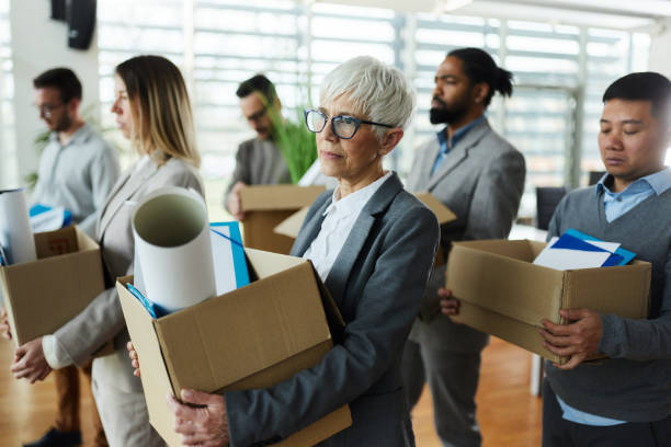 Picture showing employees packing their belongings to leave
