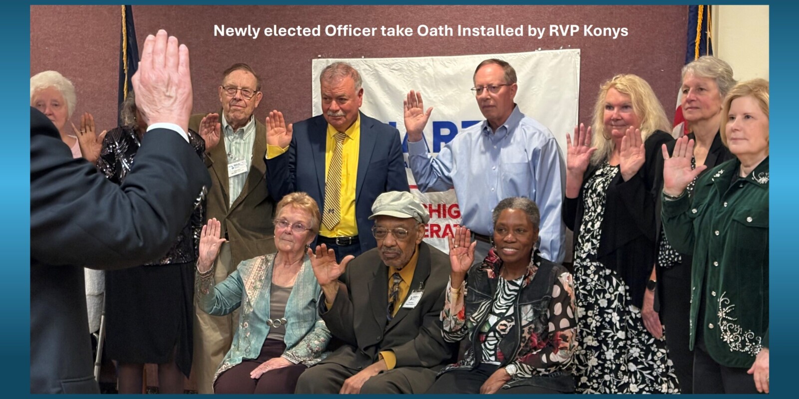 Group of officers with hands up being sworn in to office