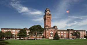 old red brick building with clock tower in center