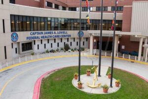 three flag poles in center of traffic circle
