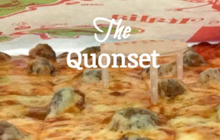 words "The Quonset" superimposed on photo of a pizza