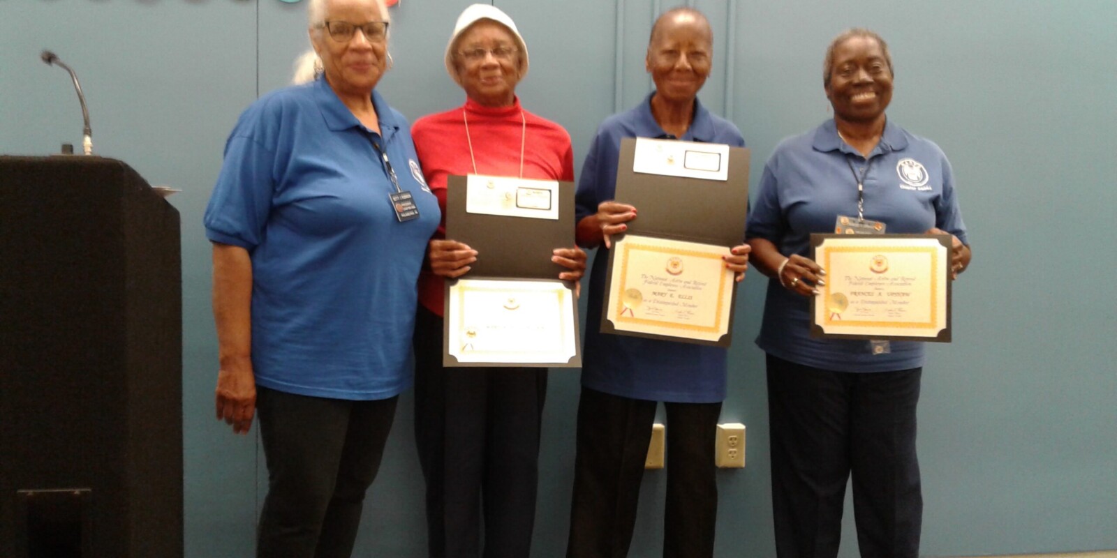 Photo of three Chapter Members receiving Certificates