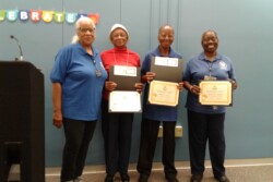 Photo of three Chapter Members receiving Certificates