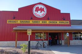 Rudy's BBQ in big red building