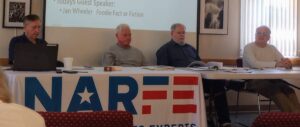 Picture of the four NARFE chapter 0869 officers sitting at the head table