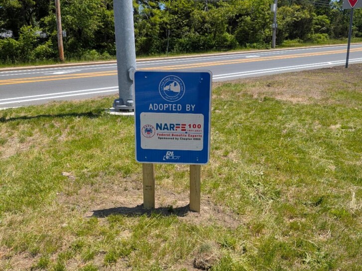 A picture of the Adopt A Spot sign