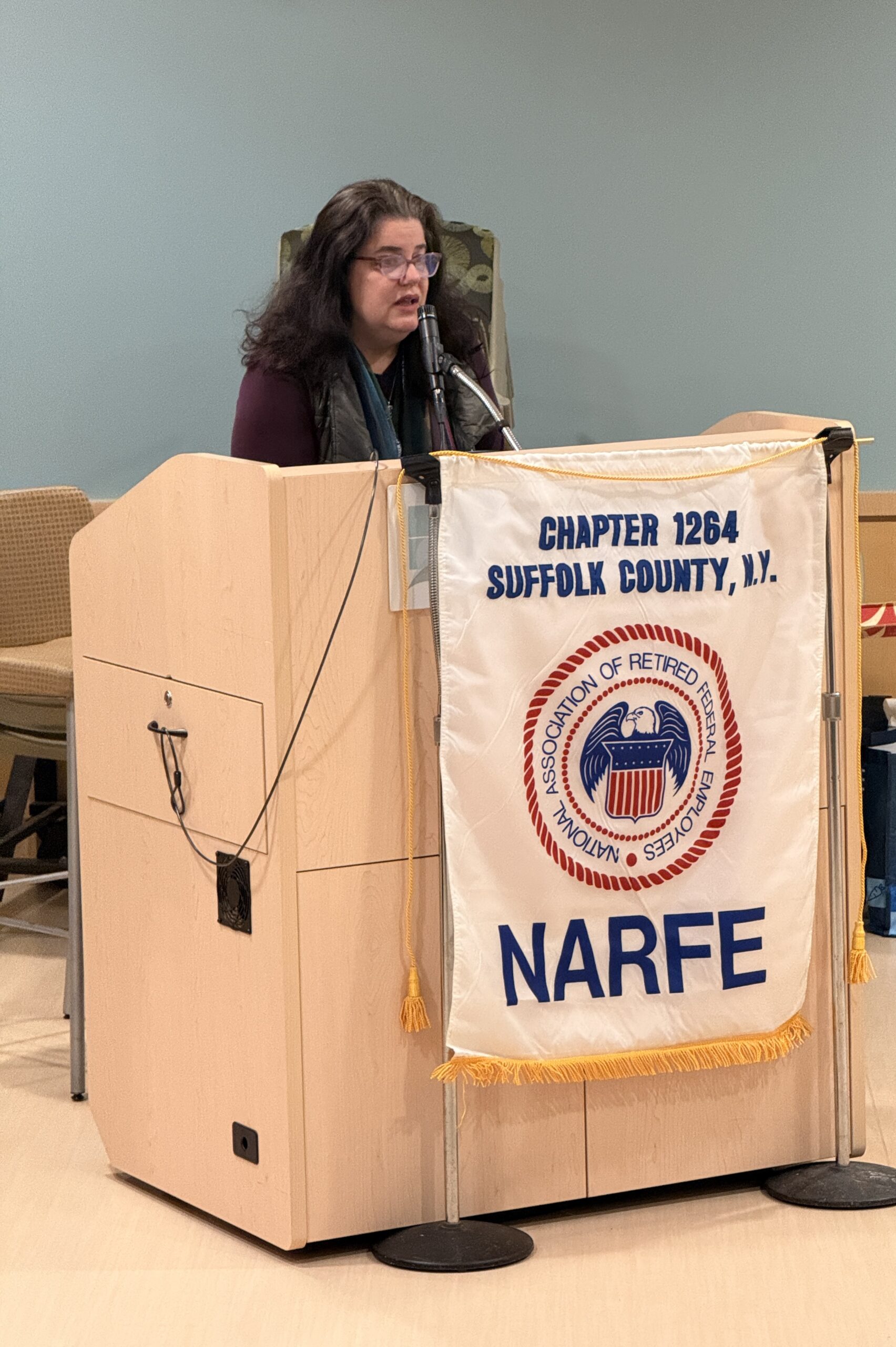 Women standing behind podium