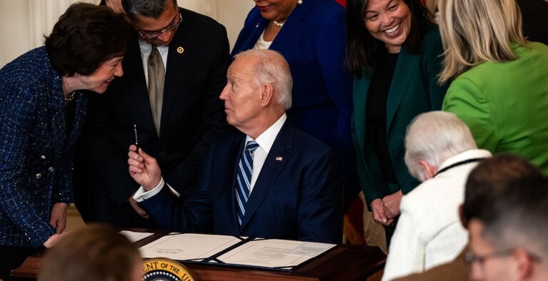 Photo showing signing of Social Security Fairness Act