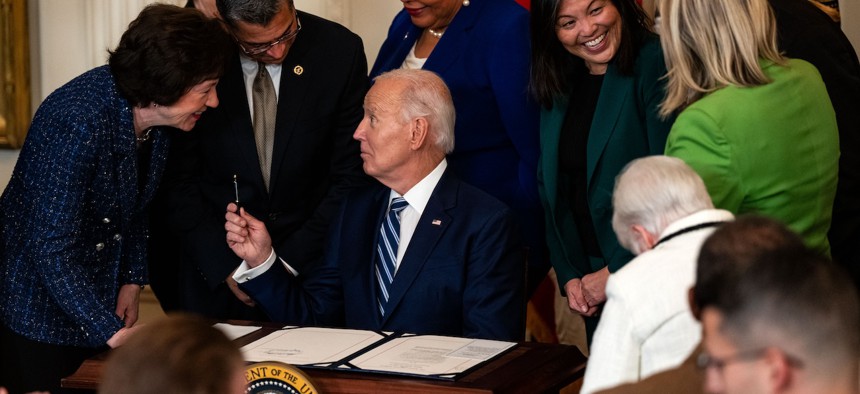 Photo showing signing of Social Security Fairness Act