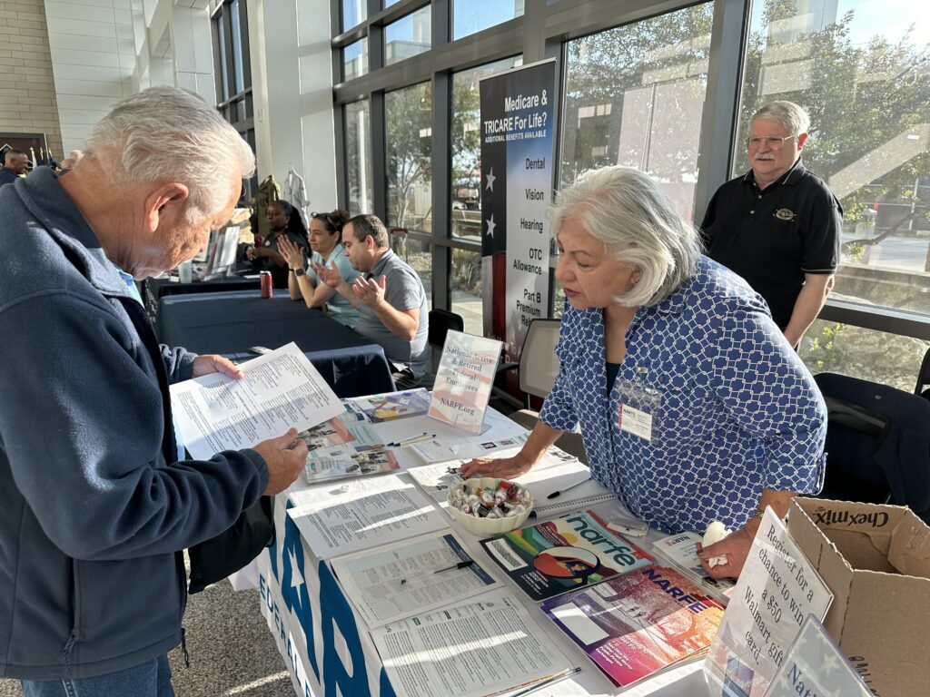 Picture of NARFE members providing information to potential active and retired civil servants on NARFE at JBSA Lackland Retiree Appreciation Day event March 2, 2024.