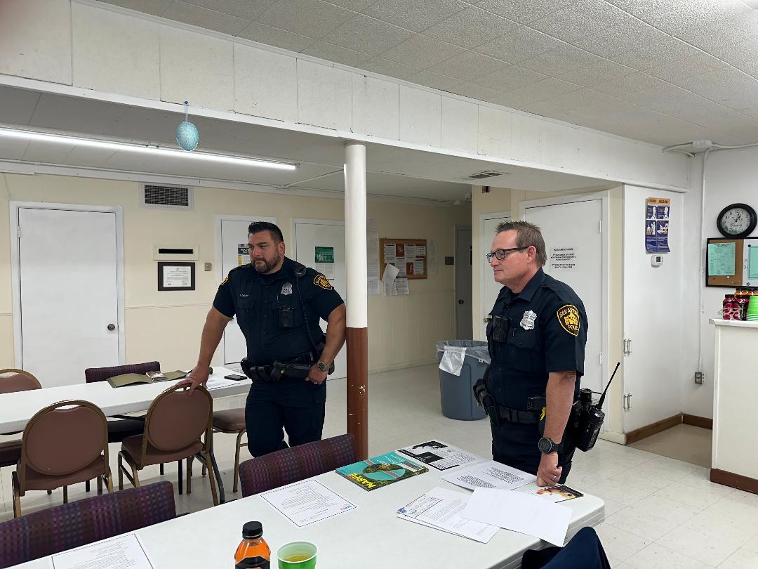 SAPD Officers discussing safety tips and scams to avoid during March 2024 Chapter meeting.