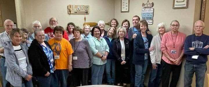 Picture of NARFE members behind a round table