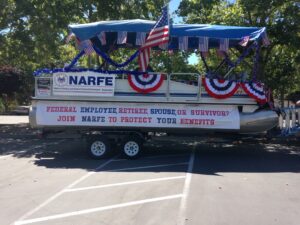 Parade float decorated with flags and banners