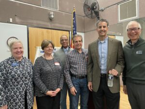 people in front of flag