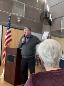 flag podium man woman
