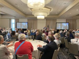man speaking at hotel conference breakfast