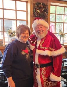 smiling woman with Santa