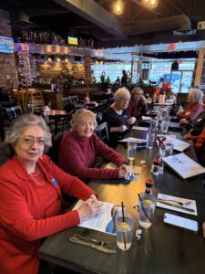 lunch gathering at restaurant with holiday lights
